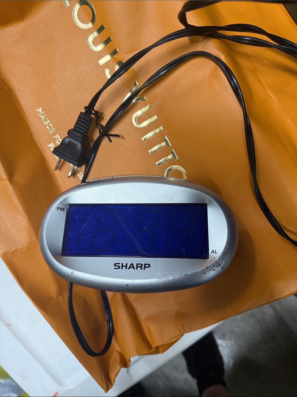 Sharp Silver Digital Clock with Blue Display